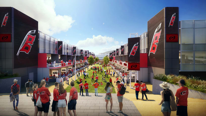 Fans gather along a grassy promenade between buildings in a developer rendering.